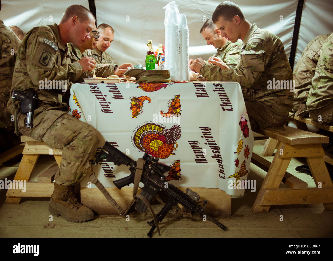 soldiers with the 173rd Airborne Brigade Combat Team enjoy a Thanksgiving meal at Combat Outpost McClain, Afghanistan, Nov. 22, Stock Photo