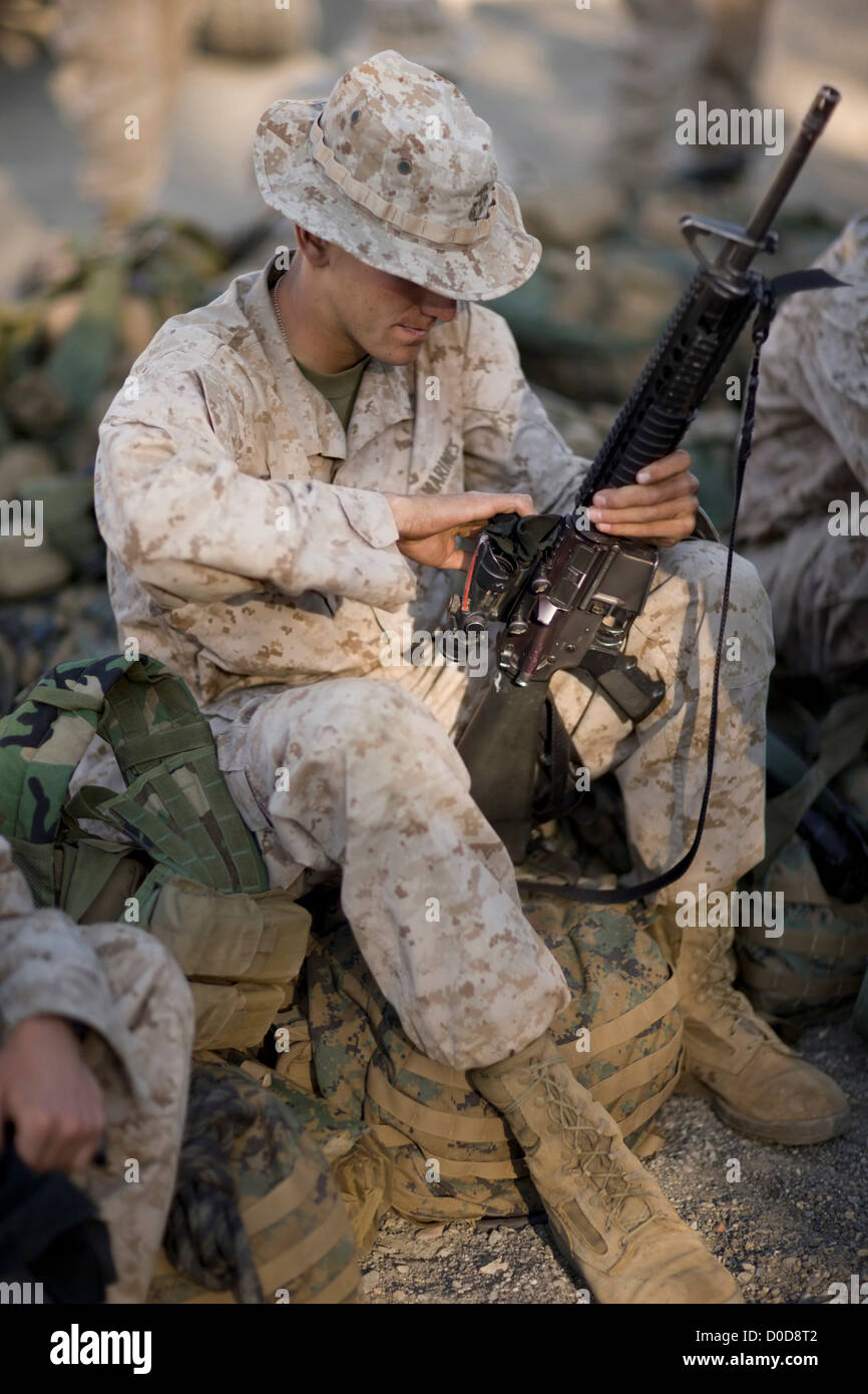 U.S. Marine Maintains His M16 Service Rifle Stock Photo