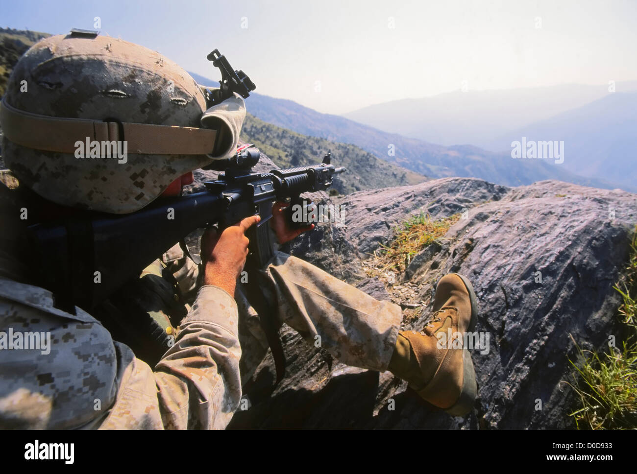 Marine Scans the Distance Through His Gunsight Stock Photo Alamy