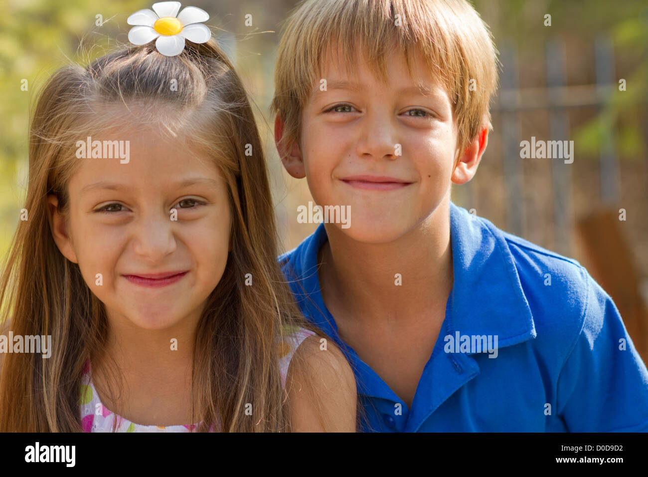 Cute little kids posing on the playgorund at bright summer day Stock ...