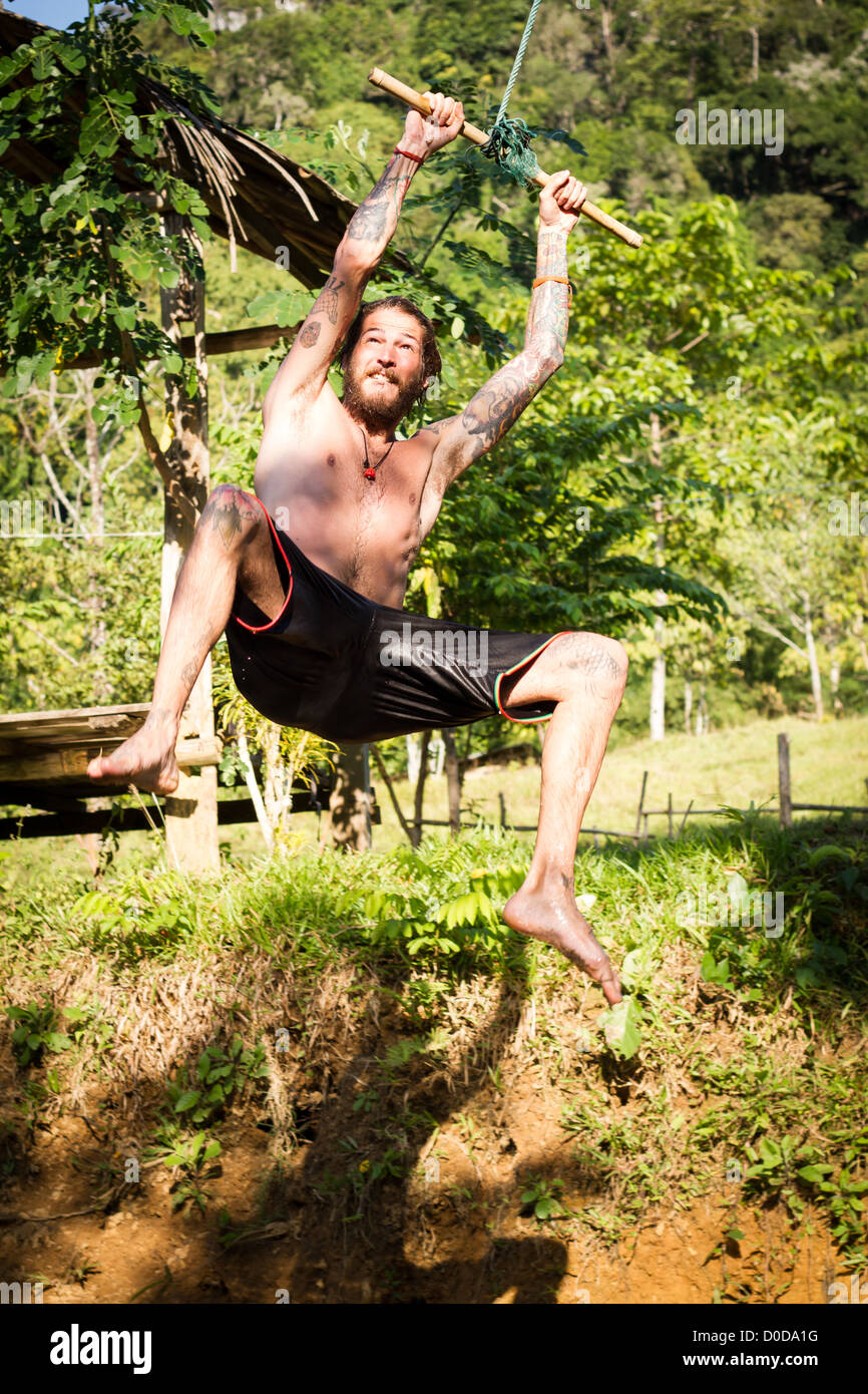 young man on a swing Stock Photo