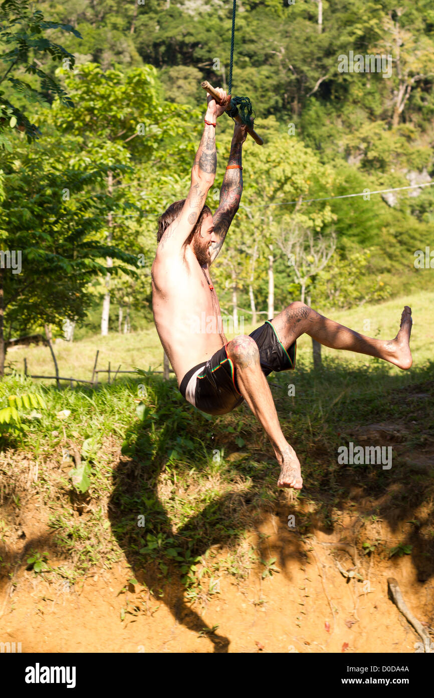 young man on a swing Stock Photo