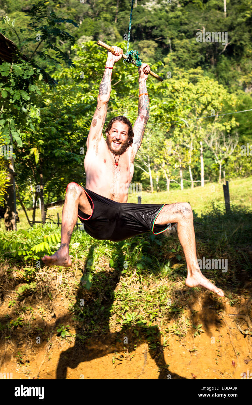 young man on a swing Stock Photo