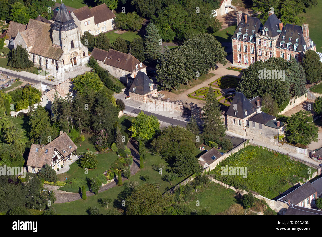 chateau-and-church-of-menilles-pacy-sur-eure-eure-27-france-stock