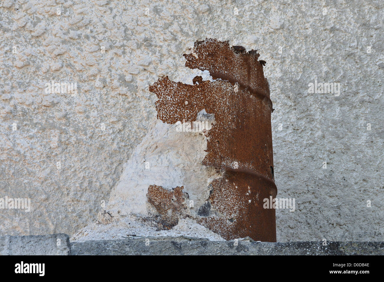 Deteriorated rusty barrel and spilled pile of marble dust powder. Stock Photo