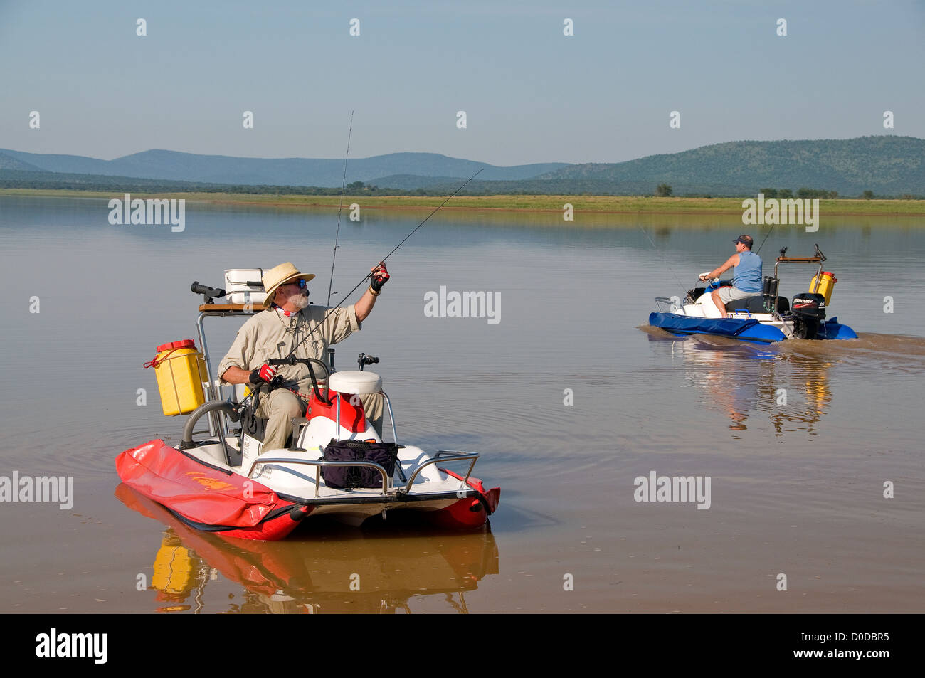 Anglers on AquaQuad boats prepare to catch tiger fish in pretty Lake Jozini on Phongolo GR, KwaZulu Natal, South Africa. Stock Photo