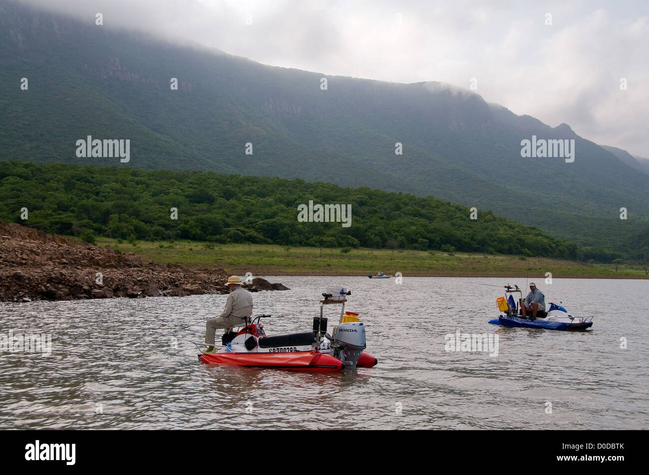 Anglers on AquaQuad boats prepare to catch tiger fish in pretty Lake Jozini on Phongolo GR, KwaZulu Natal, South Africa. Stock Photo