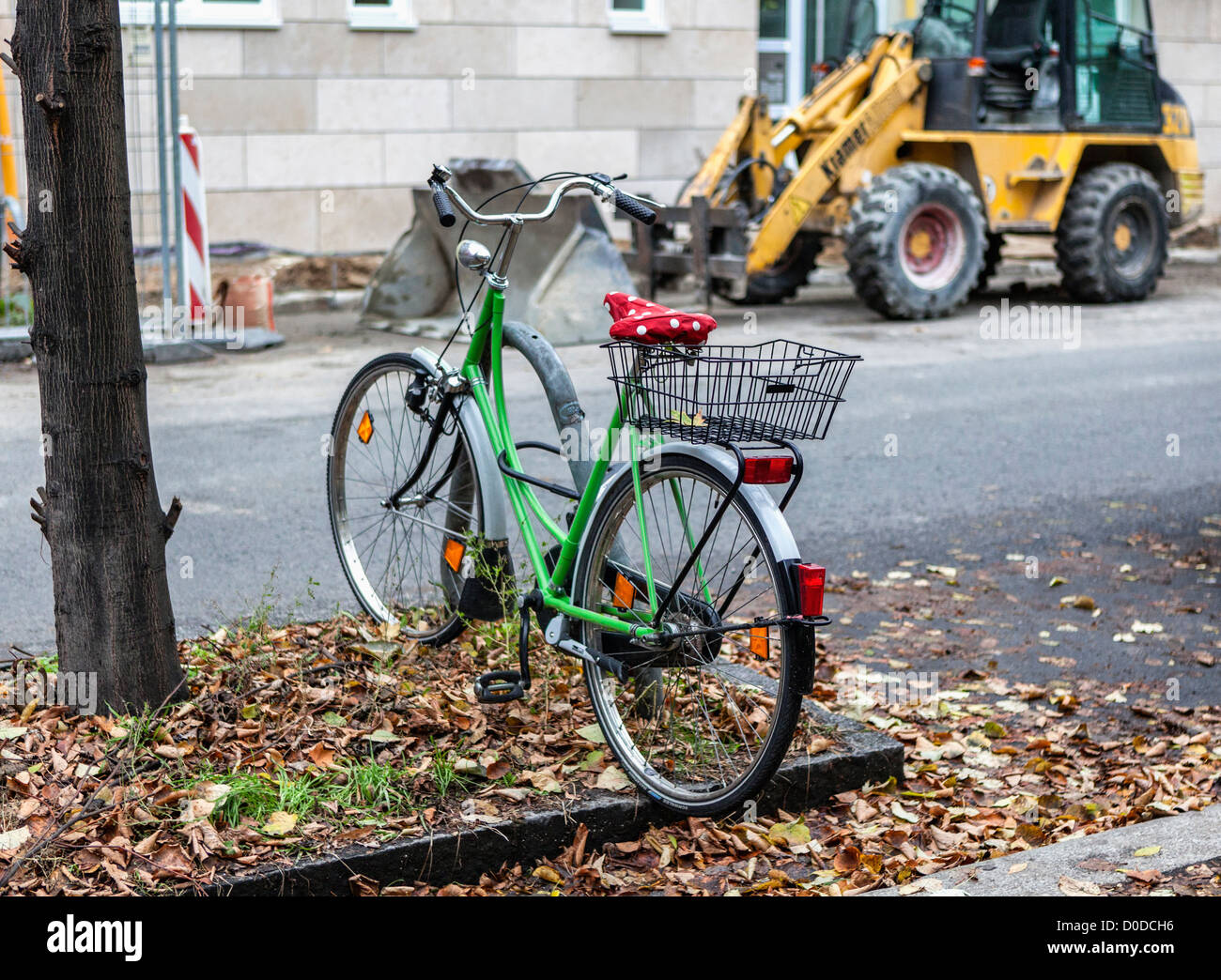 A green bicycle with a red polkadot saddle in a Berlin street Stock Photo Alamy