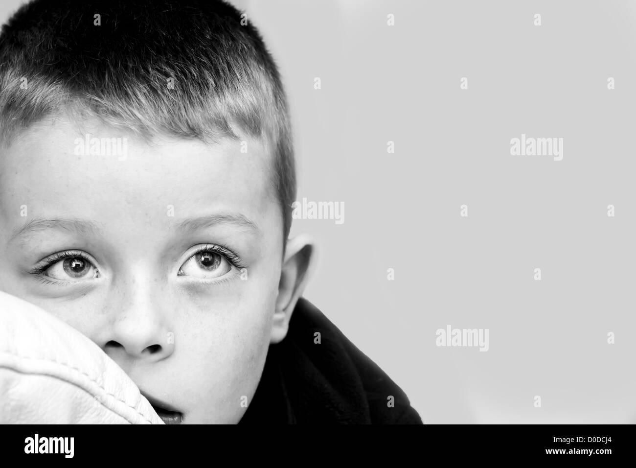 Little boy watching television in the lounge Stock Photo