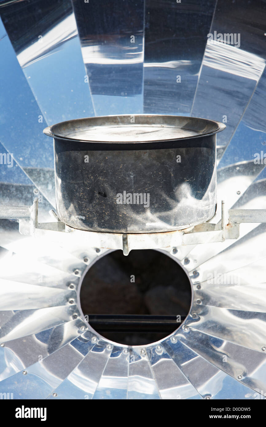 A parabolic solar water heater heats a bowl of water in the Mount Everest region, Nepal. Stock Photo