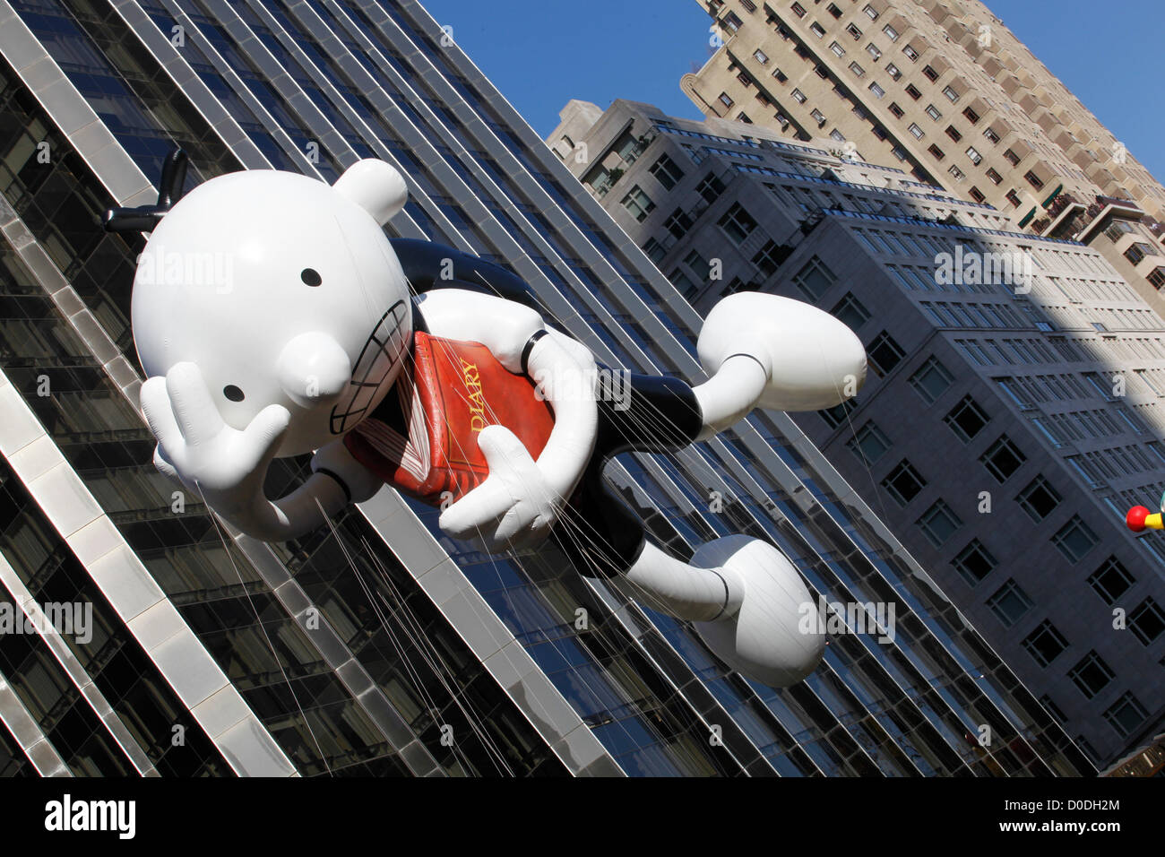 Diary of a Wimpy Kid balloon moves down Central Park West during Macy's Thanksgiving Day Parade in New York City, on Thursday, Nov. 22, 2012. Stock Photo