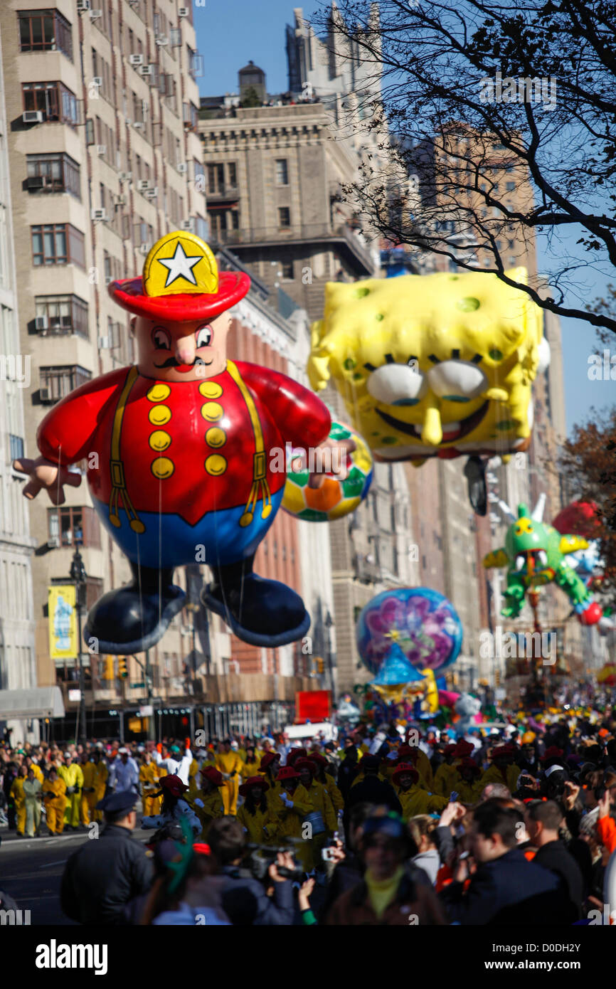 Harold the Fireman and Sponge Bob Square Pants balloons move down Central Park West during Macy's Thanksgiving Day Parade in New York City, on Thursday, Nov. 22, 2012. Stock Photo