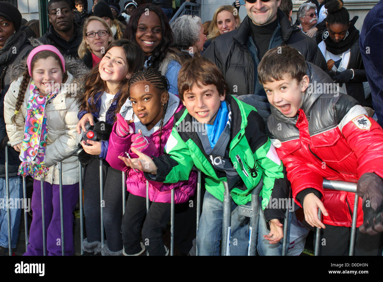 Young spectators crowd Central Park West to watch Macy's Thanksgiving Day Parade in New York City, on Thursday, Nov. 22, 2012. Stock Photo