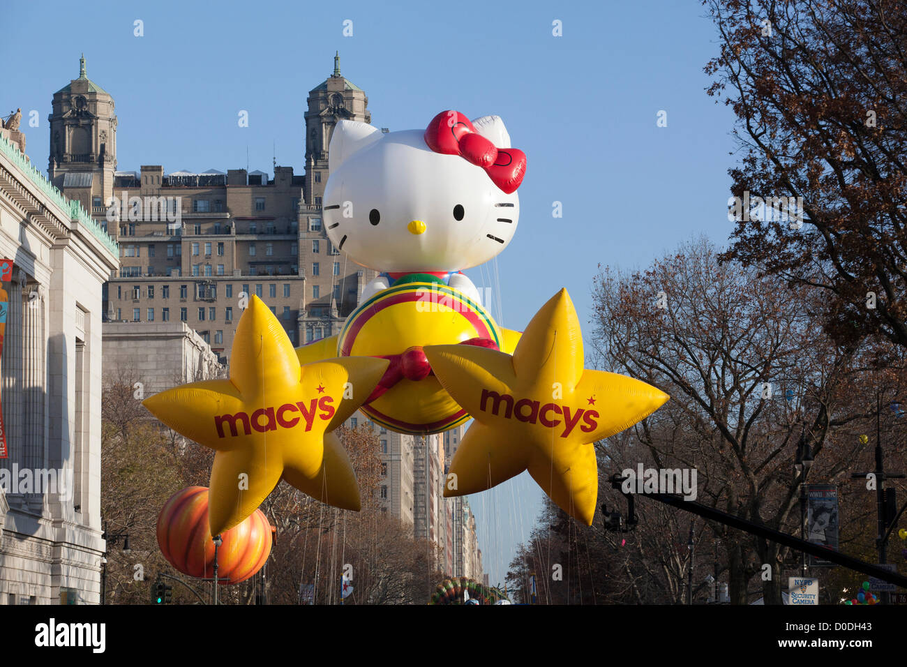 Two star balloons and a new version of the Hello Kitty balloon move down Central Park West during Macy's Thanksgiving Day Parade in New York City, on Thursday, Nov. 22, 2012. Stock Photo