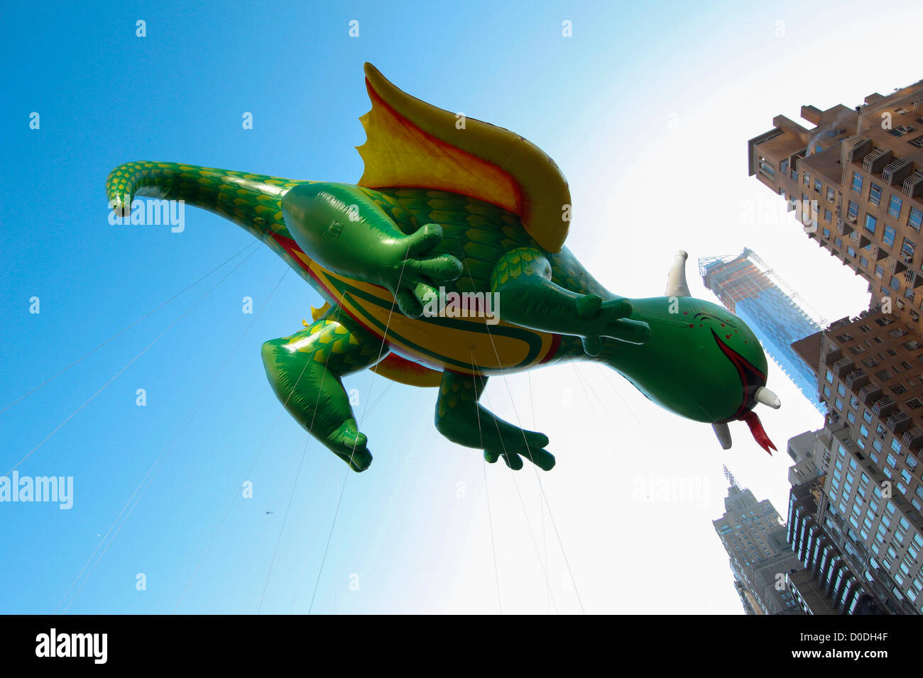 Rex the Happy Dragon balloon soars over Columbus Circle during Macy's Thanksgiving Day Parade in New York City, on Thursday, Nov. 22, 2012. Stock Photo