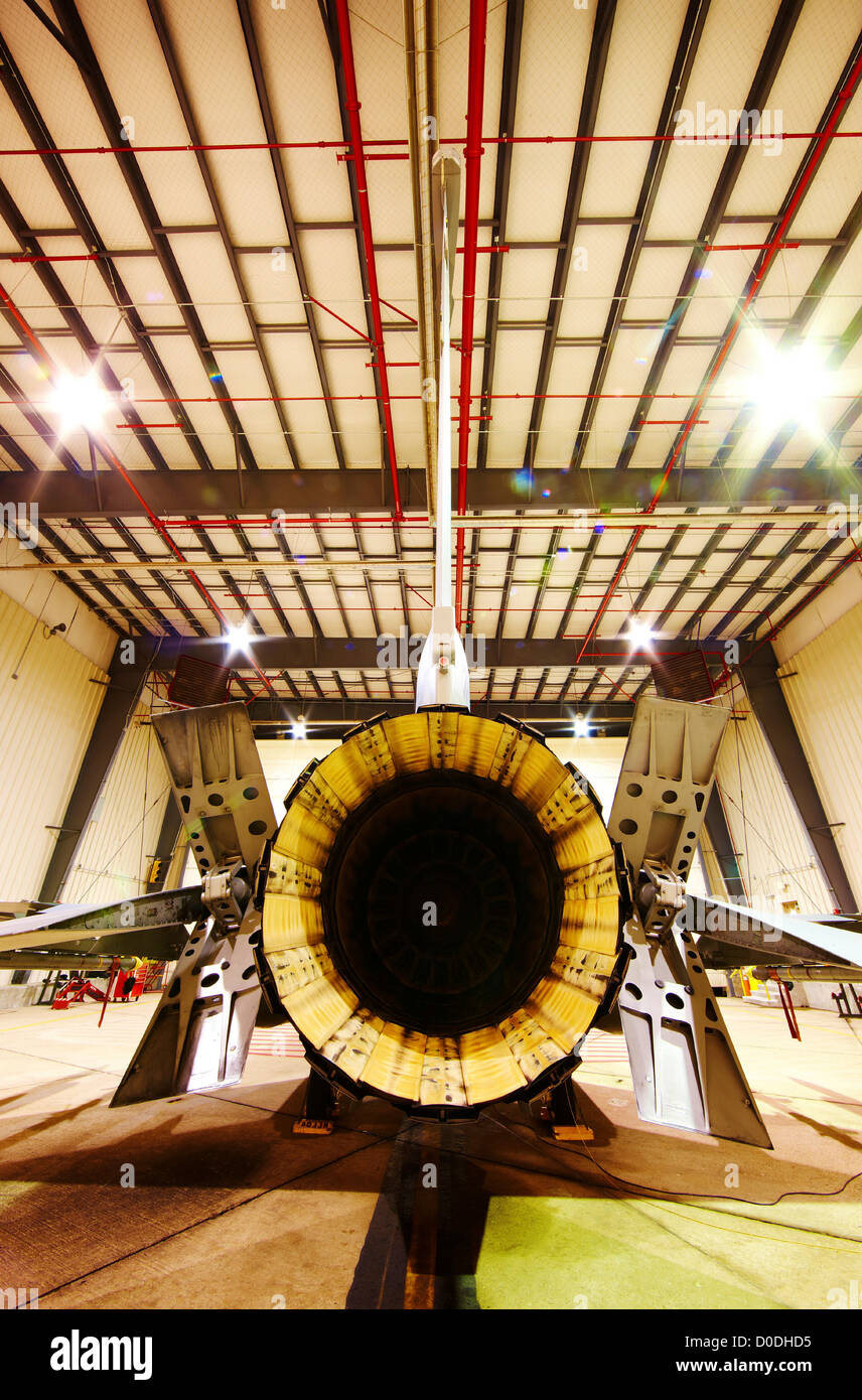 F-16 in hangar, rear view showing engine exhaust Stock Photo