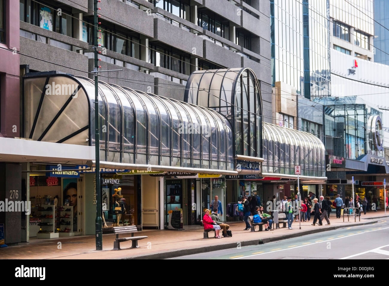 Lambton Quay, the main shopping street in Wellington, New Zealand, people sitting on benches, waiting at bus stop. Stock Photo