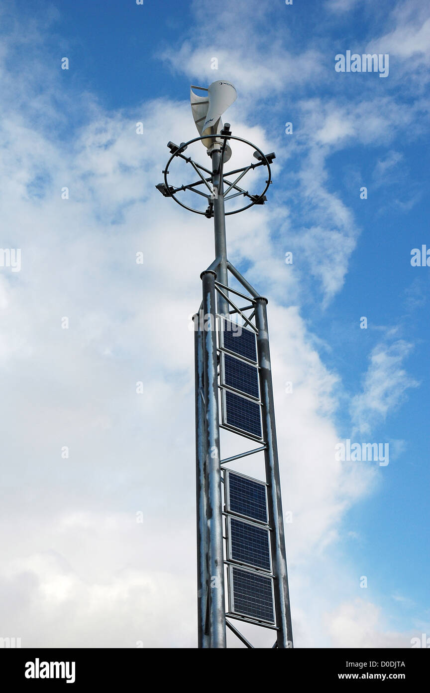 Wind turbines and solar panels on same tower Stock Photo