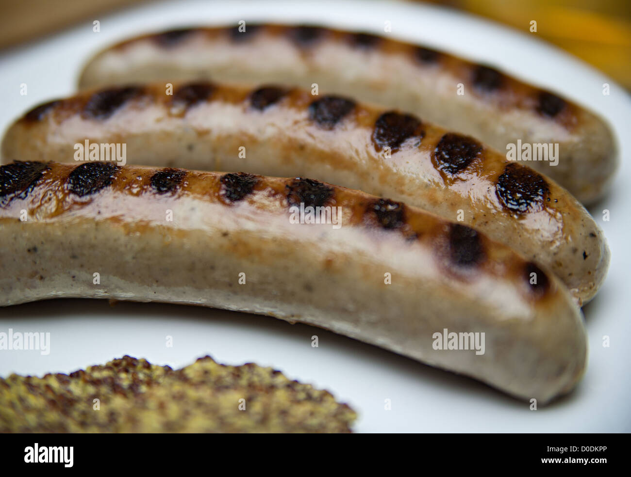 Barbequed bratwurst sausages Stock Photo
