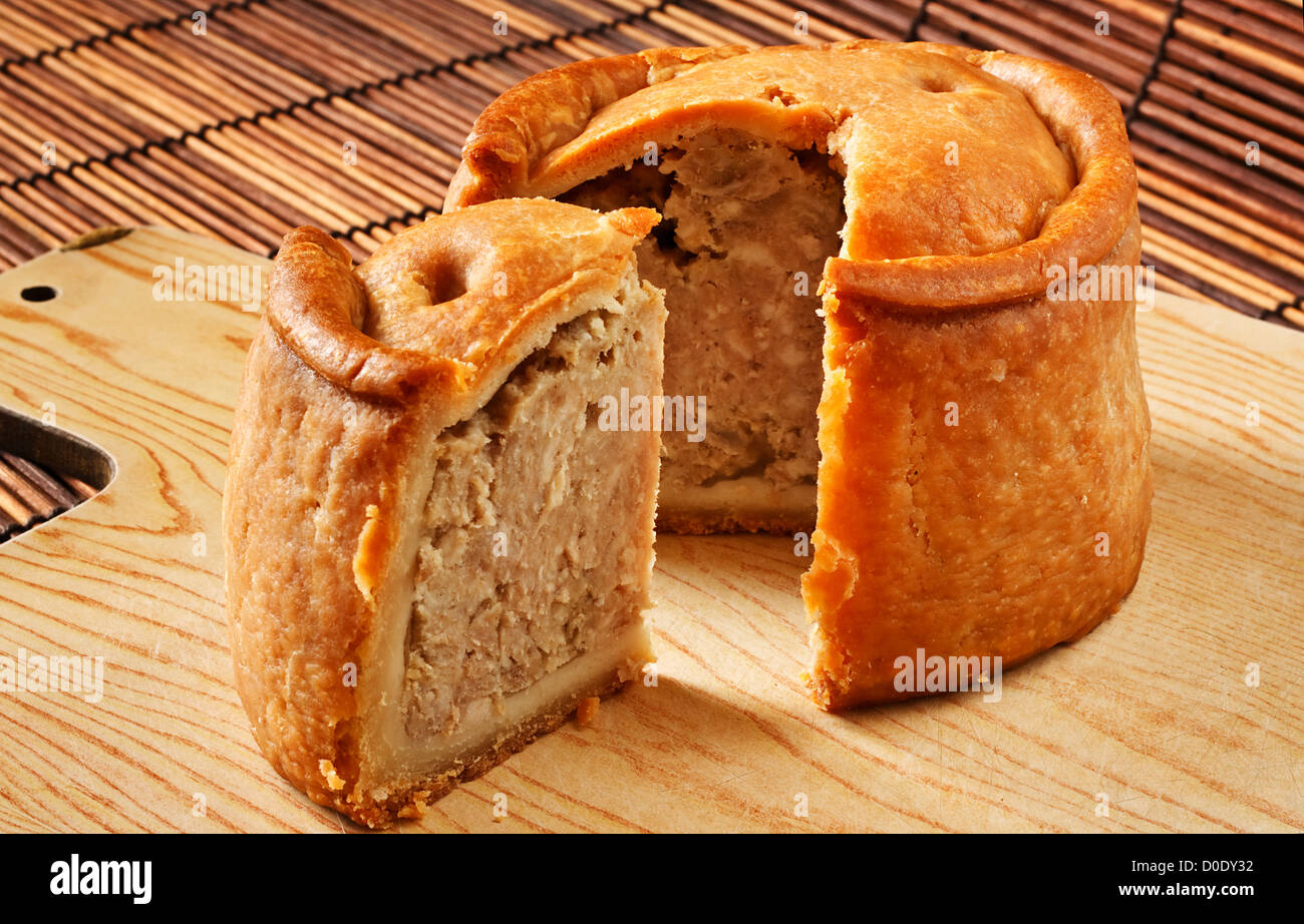 A traditional handmade pork pie traditionally called Melton Pies from the town of Melton Mowbray in the Midlands, England Stock Photo