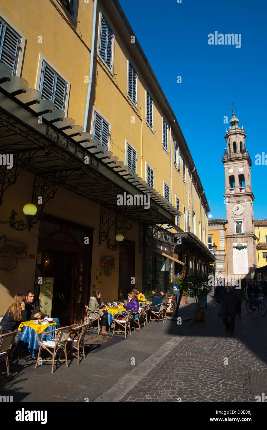 Street cafe with the San Giovanni Evangelista church bell tower in background central Parma city Emilia-Romagna region Italy Stock Photo