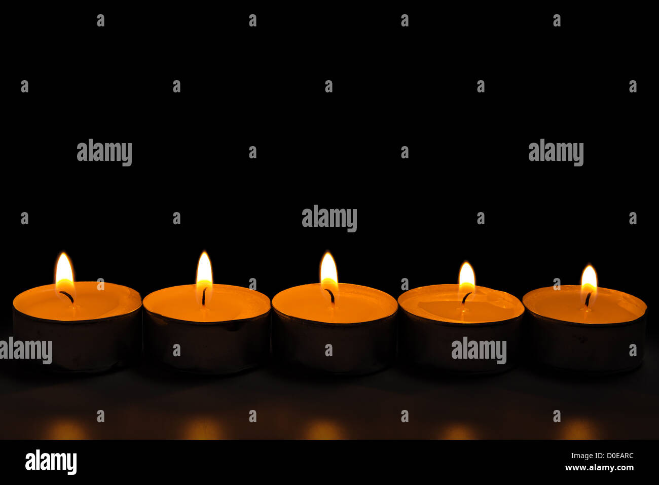 dark composition from row of burning candles Stock Photo Alamy