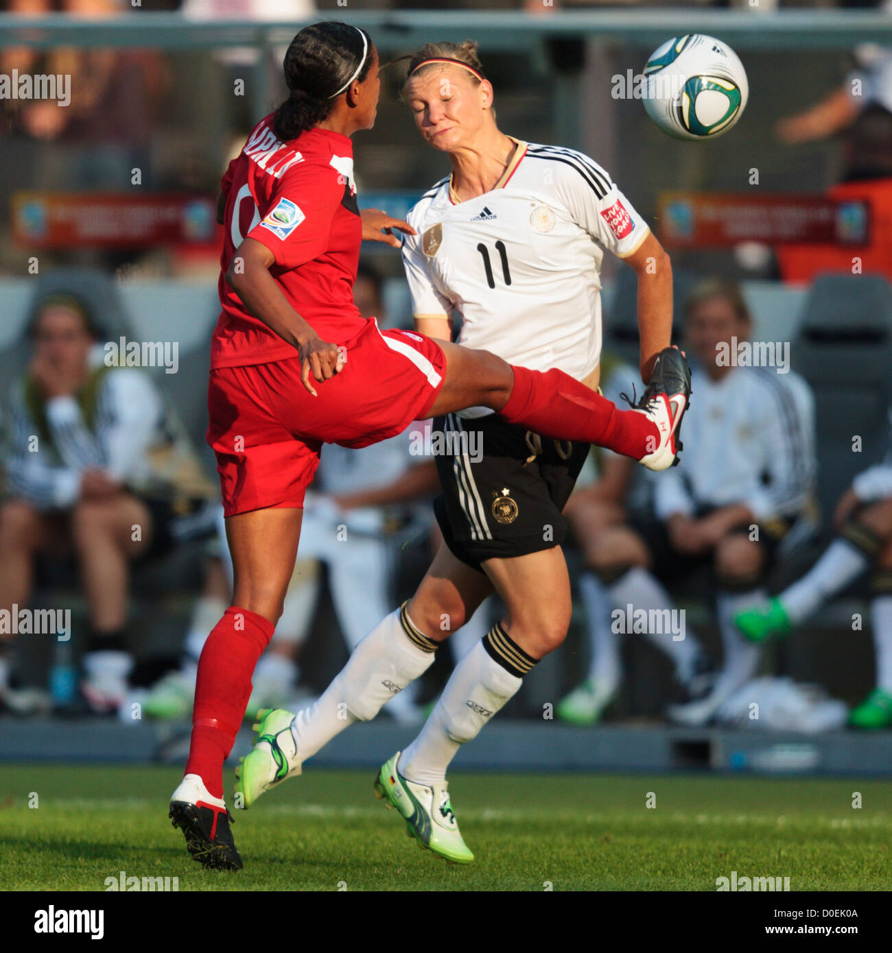 Candace Chapman of Canada (L) kicks the ball ahead of Alexandra Popp of Germany (R) during the opening match of the World Cup Stock Photo