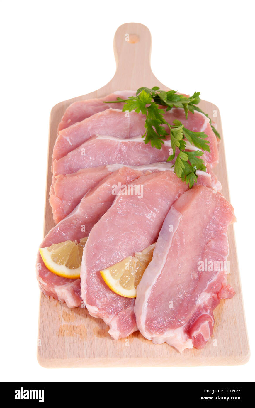 part of pork loin on desk-board isolated on white background Stock Photo