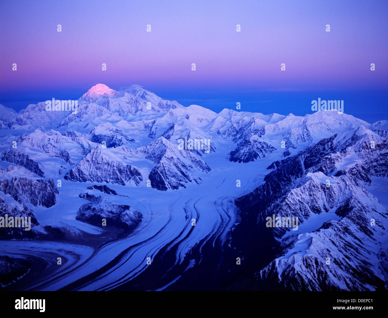 First Light of Sunrise Illuminating the Summit of Mt. McKinley Stock