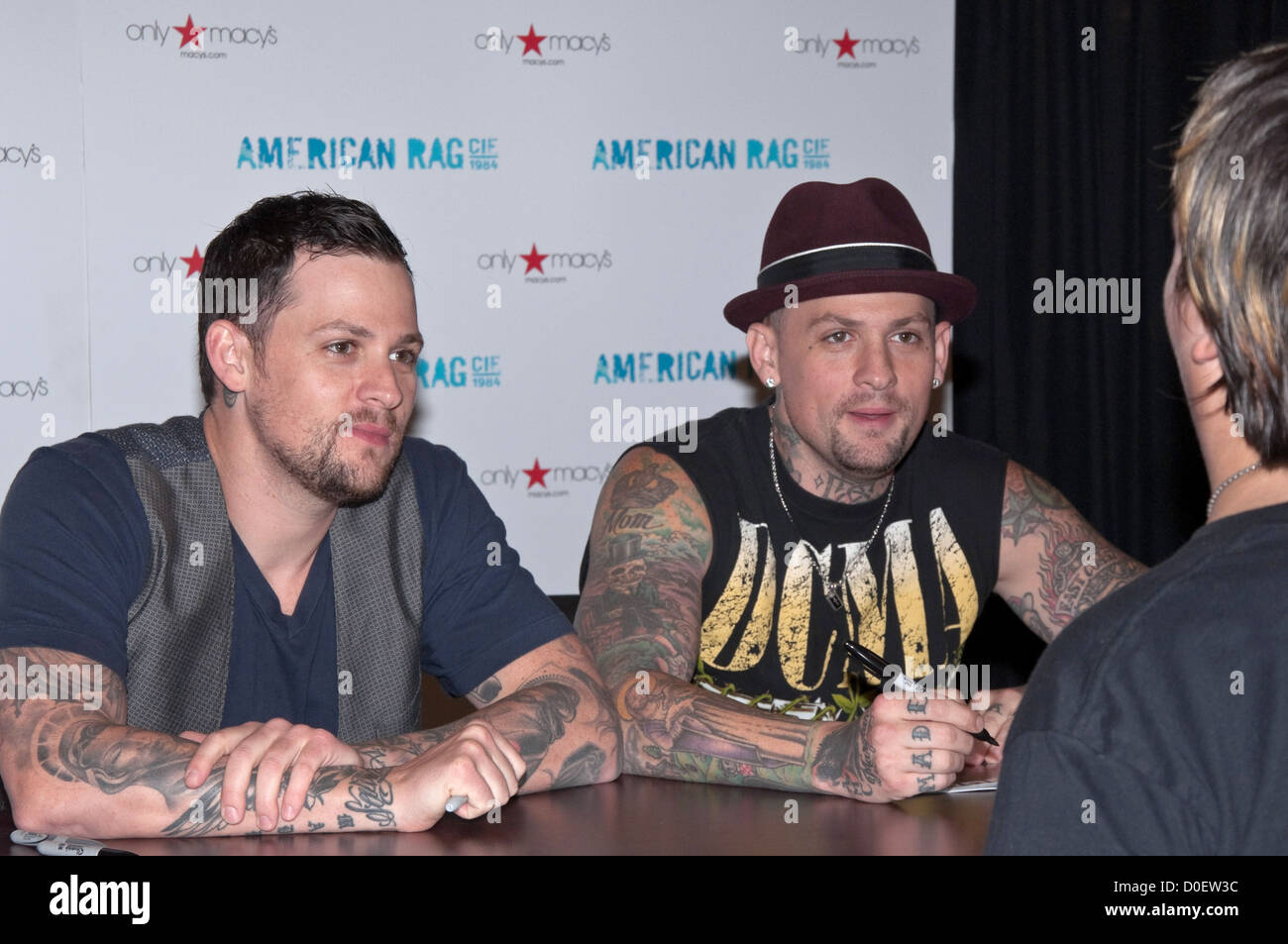 Joel Madden Benji Madden Benji and Joel Madden of Good Charlotte sign autographs after their performance at Macy's. Cherry Stock Photo