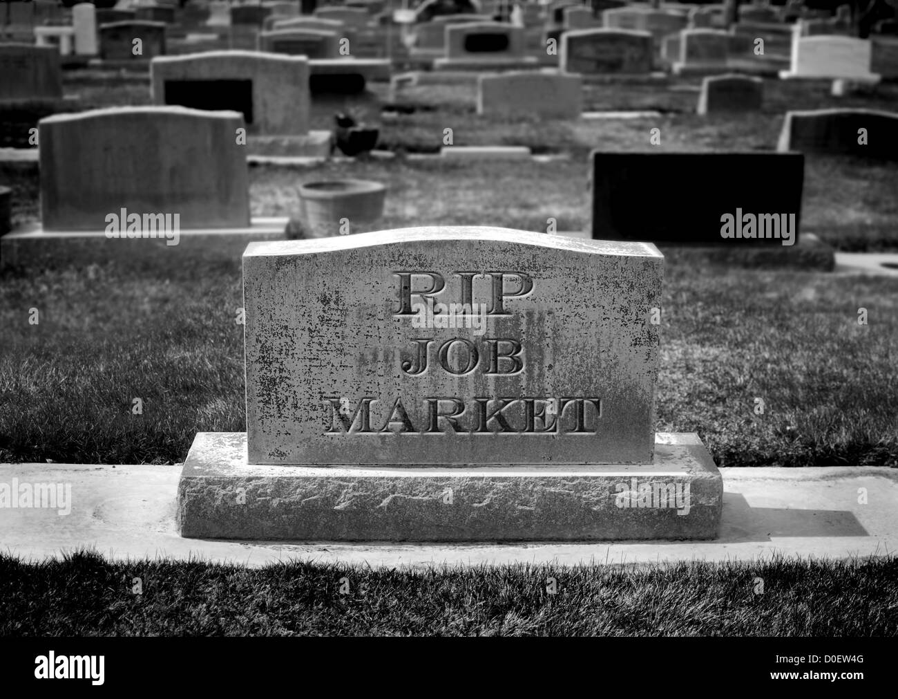 Gravestone in cemetery for job market and employment Stock Photo