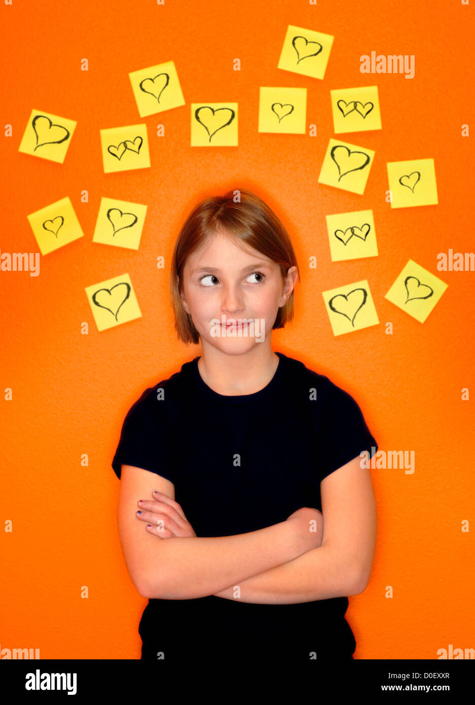 Young girl with sticky notes around her head representing her thoughts Stock Photo