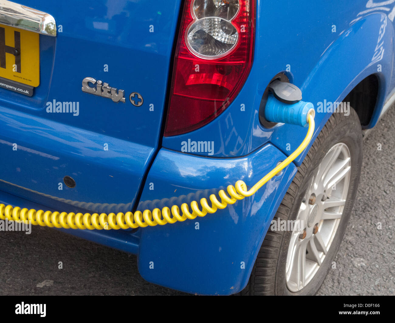 Electric car charging in street in London Stock Photo Alamy
