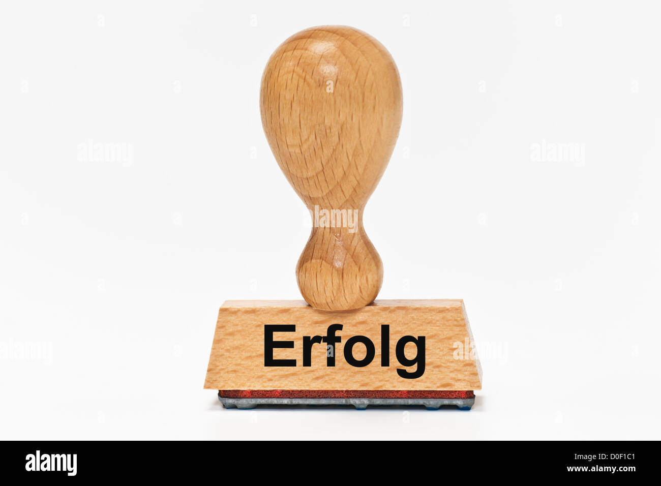 One Stamp with the German inscription Erfolg (Success) upright, background white. Stock Photo