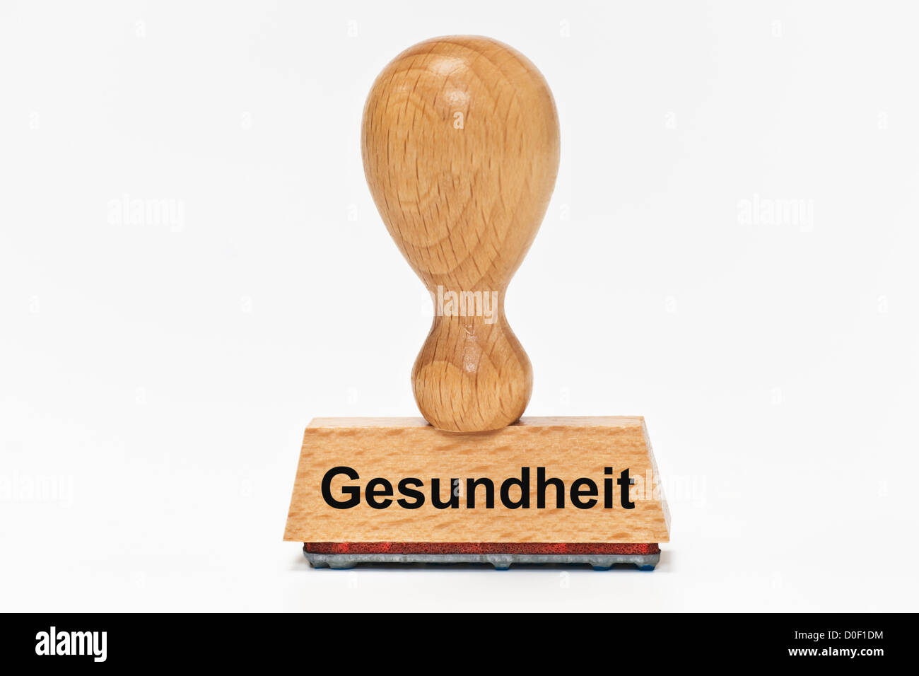 One Stamp with the German inscription Gesundheit (Health) upright, background white Stock Photo