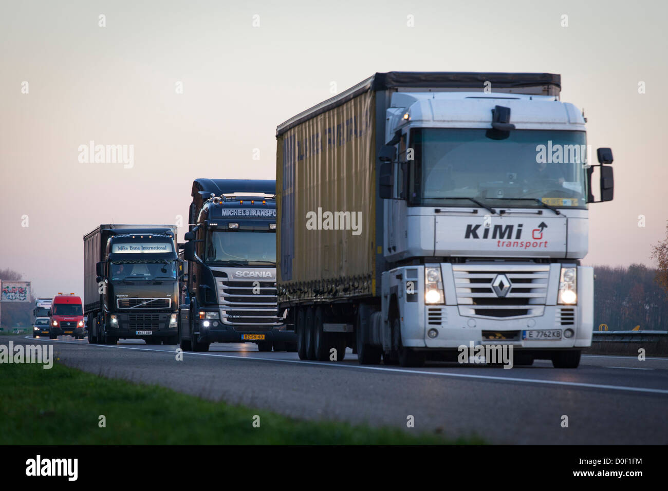 Transport trucks on Dutch highway A67 in Europe Stock Photo Alamy