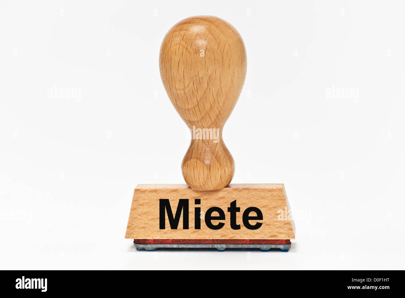 One Stamp with the German inscription Miete (Rent) upright, background white. Stock Photo