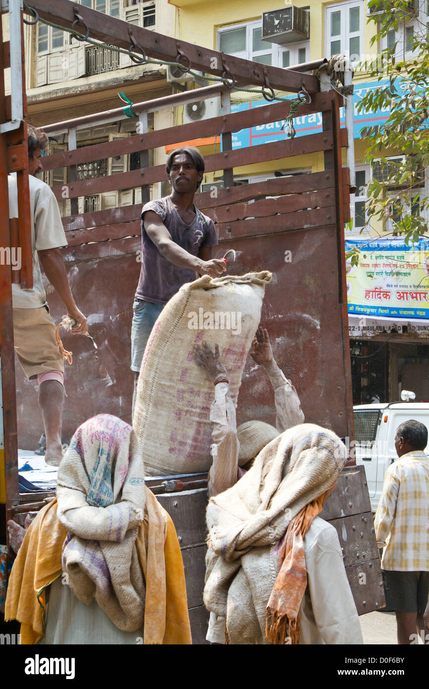 Man carrying cement bag hires stock photography and images Alamy