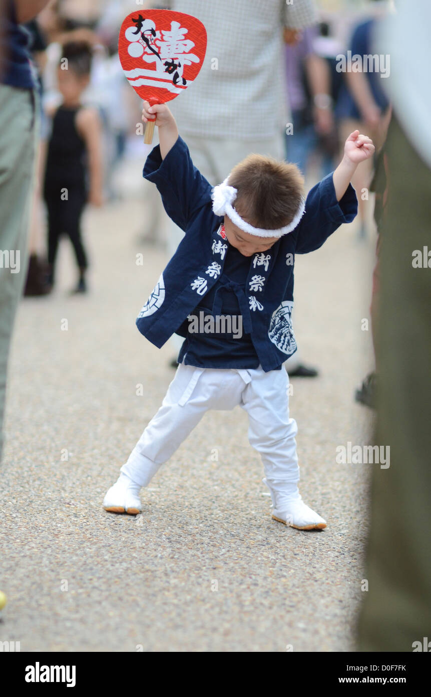 A small boy enjoying himself at the Kishiwada Danjiri festival in Osaka, Japan. Stock Photo