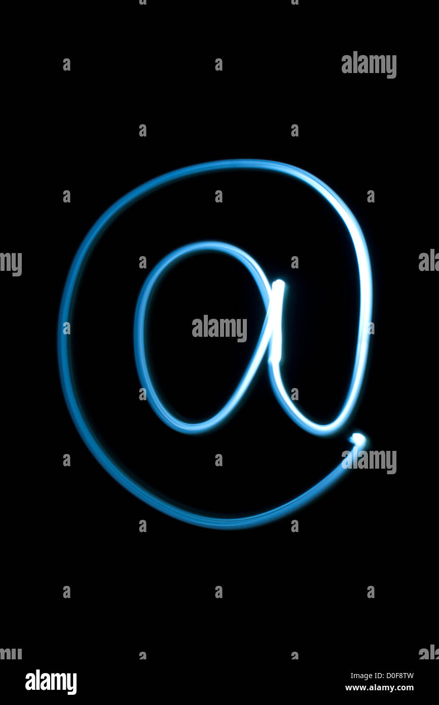 At sign from natural neon light Stock Photo - Alamy