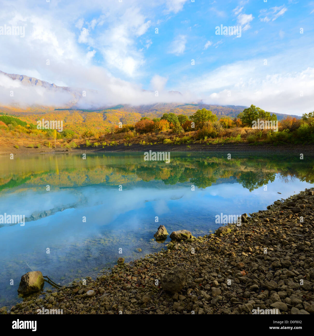 Mountain reflections in a deep quiet lake Stock Photo