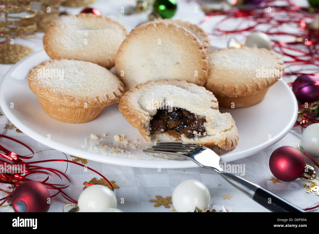 Mince pies on a plate surrounded by holiday decorations Stock Photo - Alamy