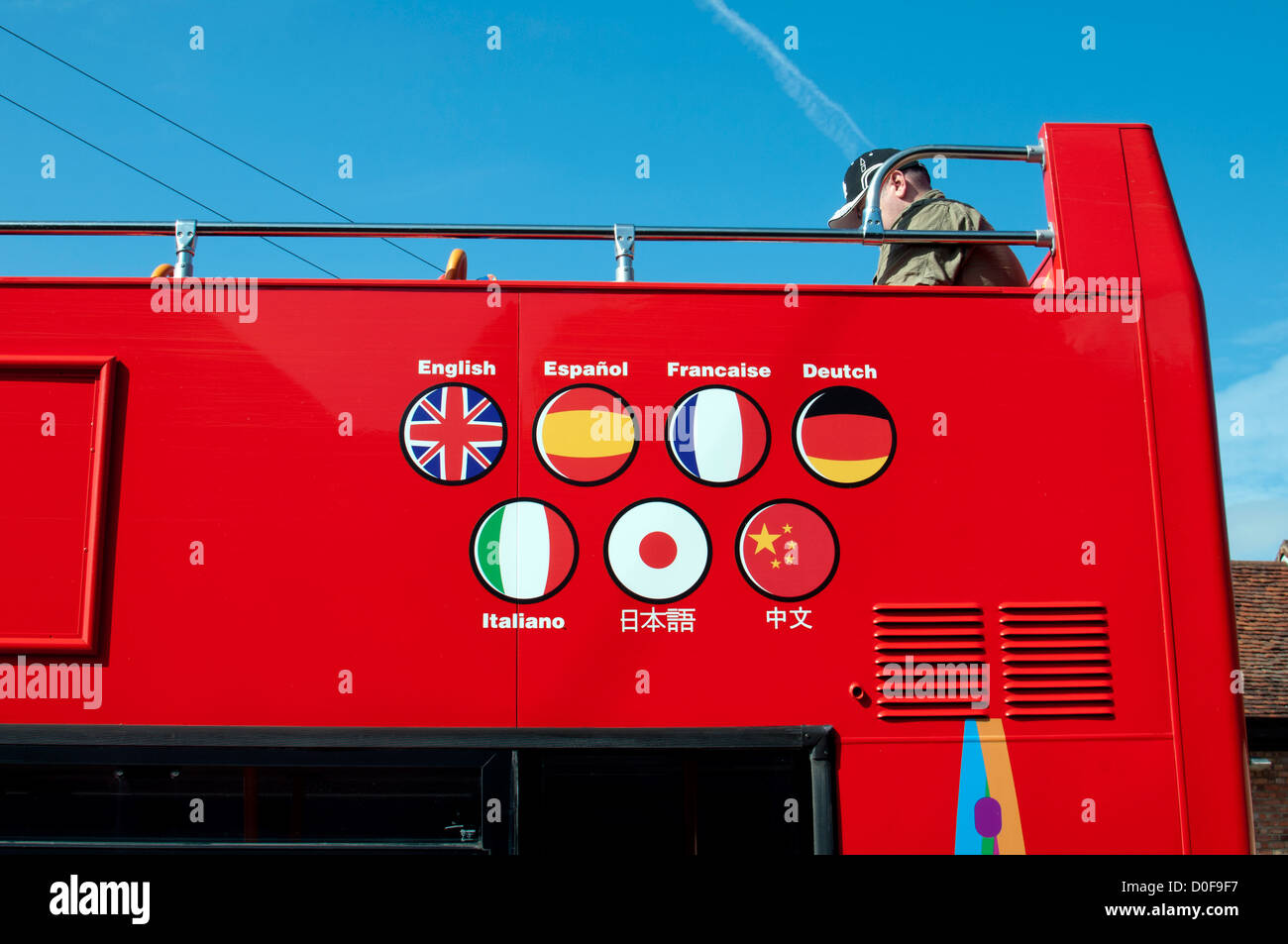 Open-top tour bus with international languages commentaries symbols, Stratford-upon-Avon, UK Stock Photo