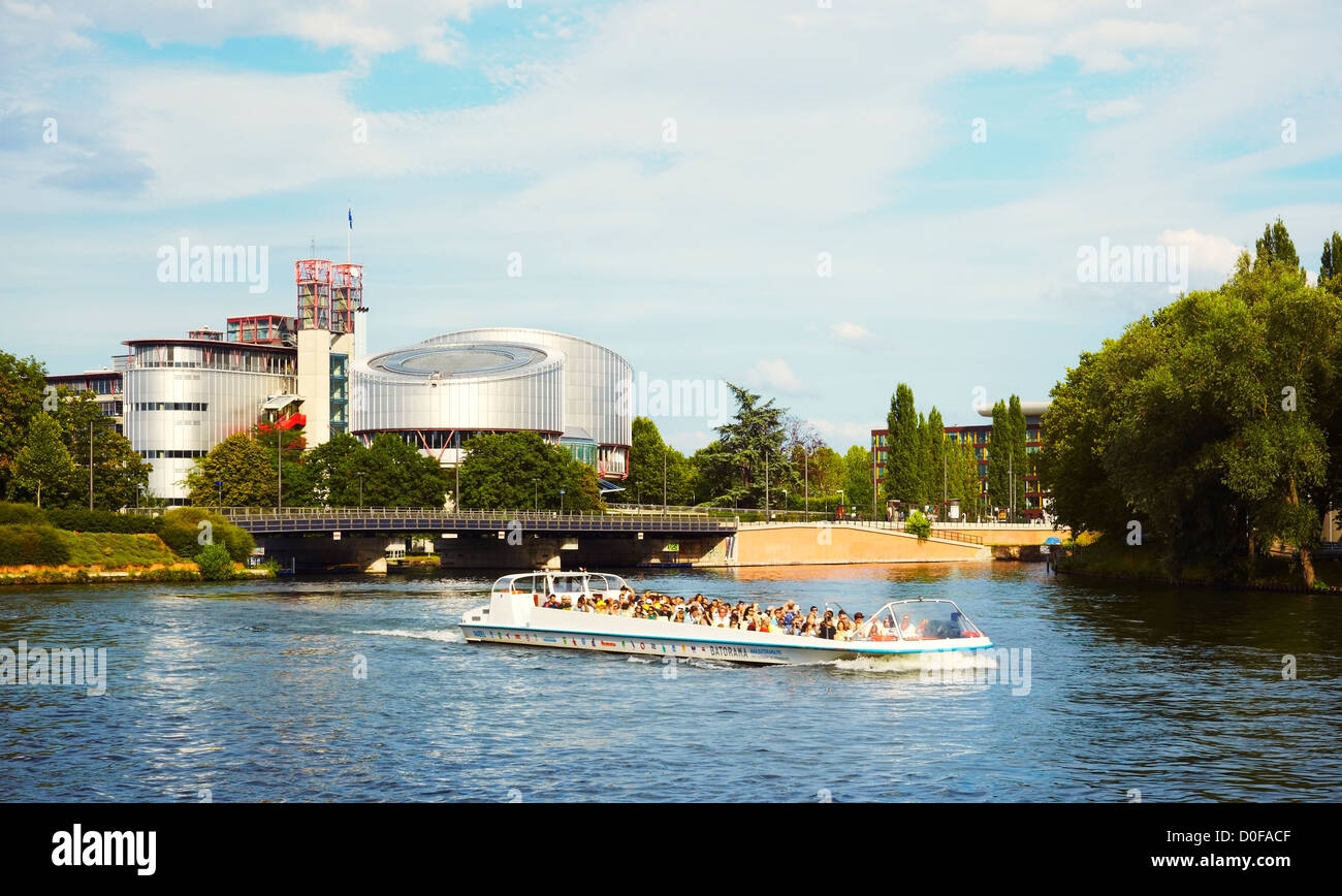 Boat sailing the Rhin river by the European Court of Human Rights building, Strasbourg, Alsace, France Stock Photo