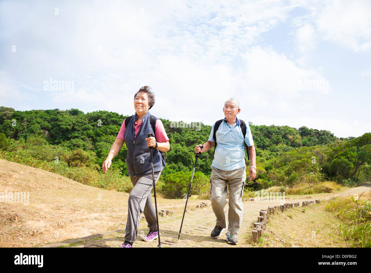 happy asian senior couple hiking Stock Photo - Alamy