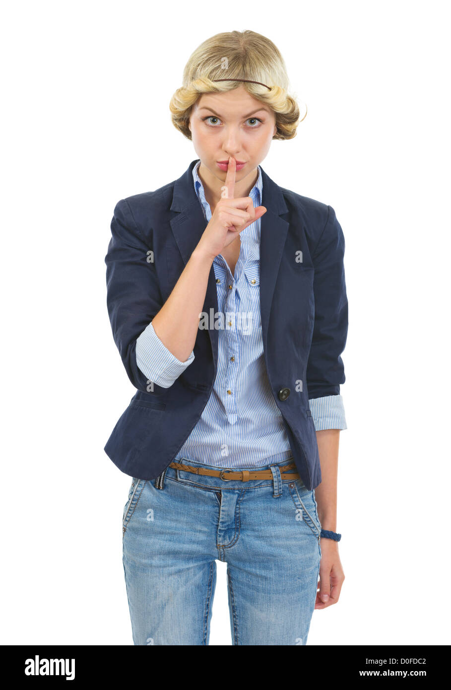 Teenage girl showing shh gesture Stock Photo - Alamy