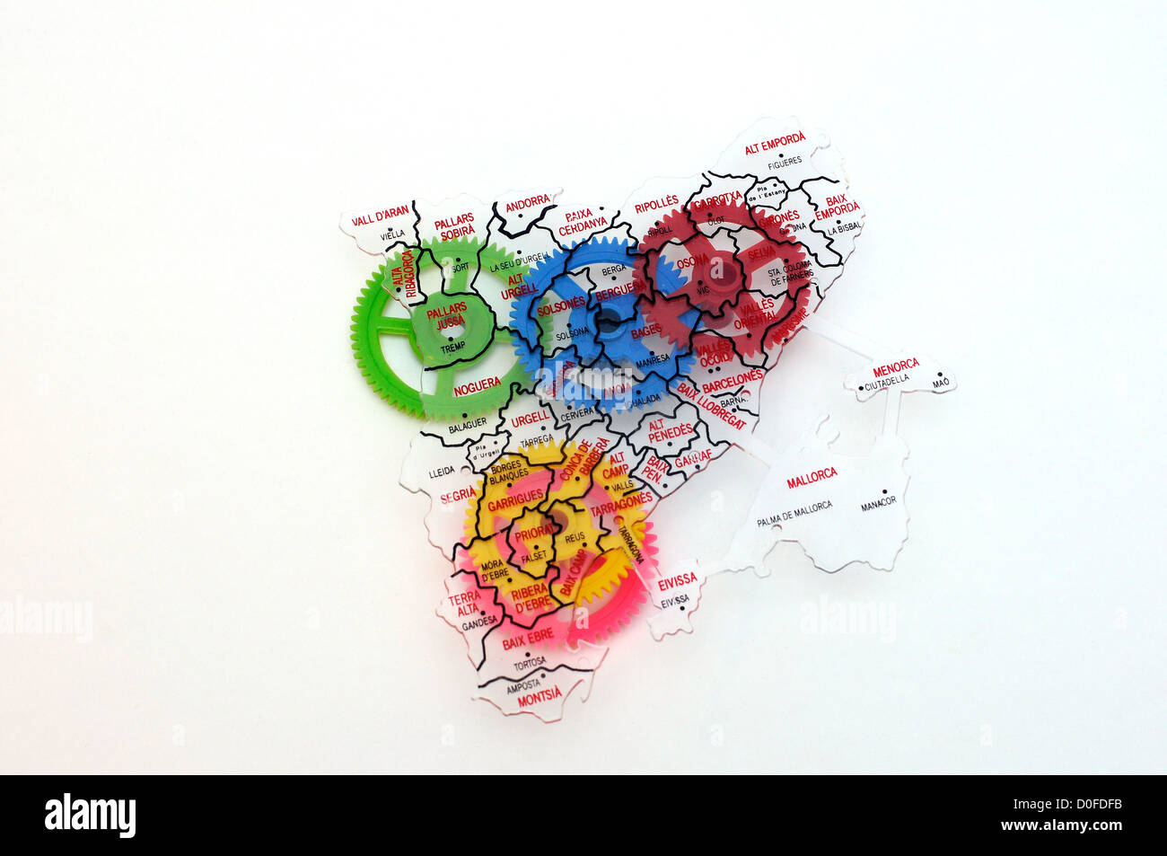 gearing colored, merger, mechanism, gears under Catalonia map Stock Photo