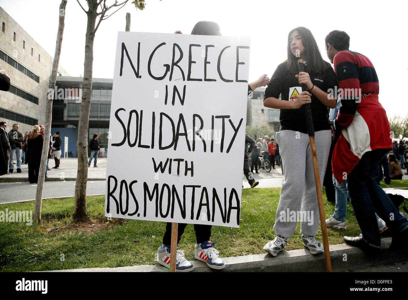 Thessaloniki,Greece. November 24, 2012. Protesters carrying placard that reads 'North Greece in solidarity with Rosia Montana'. Thousands of people flooded the streets of Thessaloniki to protest against efforts by Hellas Gold, a subsidiary of the Canadian firm Eldorado Gold, to mine the Skouries quarry on Mount Kakkavos, in the Halkidiki peninsula and the city of Kilkis in northern Greece. Stock Photo