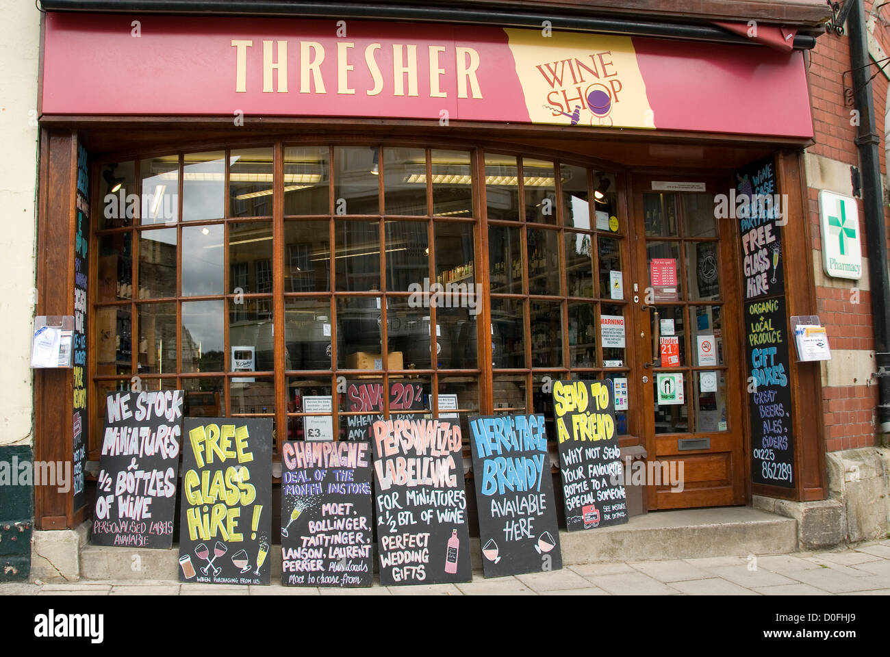 Tresher wine shop, signboards, Bradford on Avon, Wiltshire, England, UK