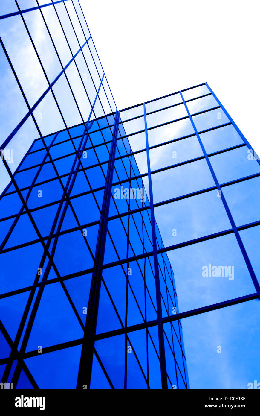 Office building details reflecting blue sky and clouds in windows Stock ...